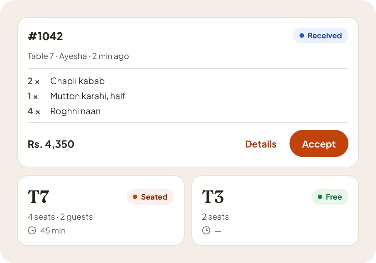 A waiter’s order card waiting for approval, and two table cards.